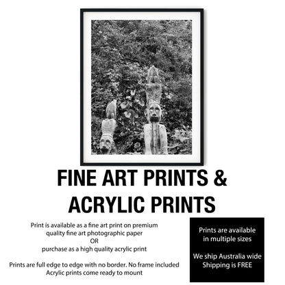 Carved Wooden Totem Poles in Lush Foliage Black and White Print
