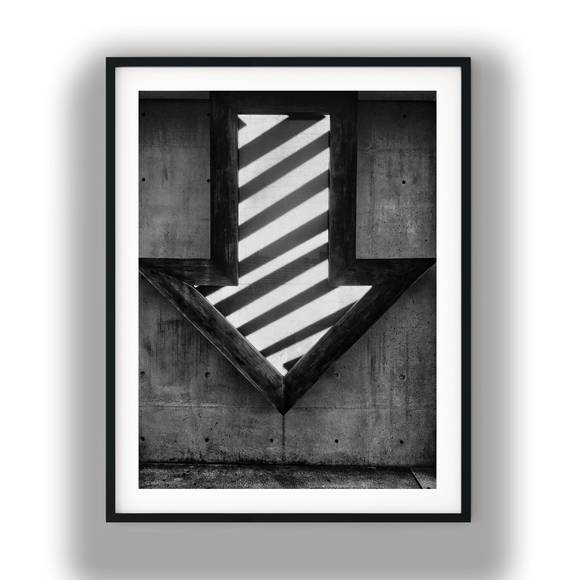 Illuminated Geometric Down Arrow on Textured Concrete Wall Black and White Print
