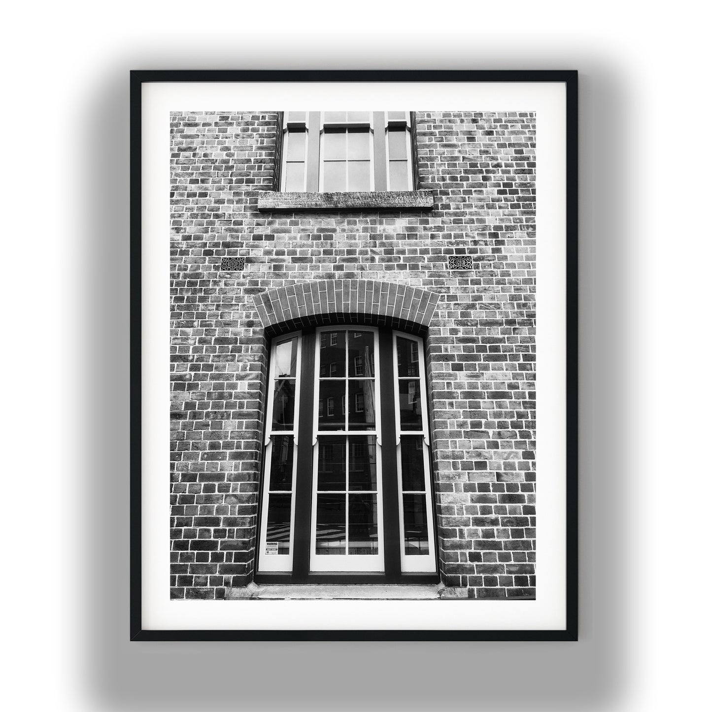 Vintage Arched Sash Windows on Brick Facade Black and White Print