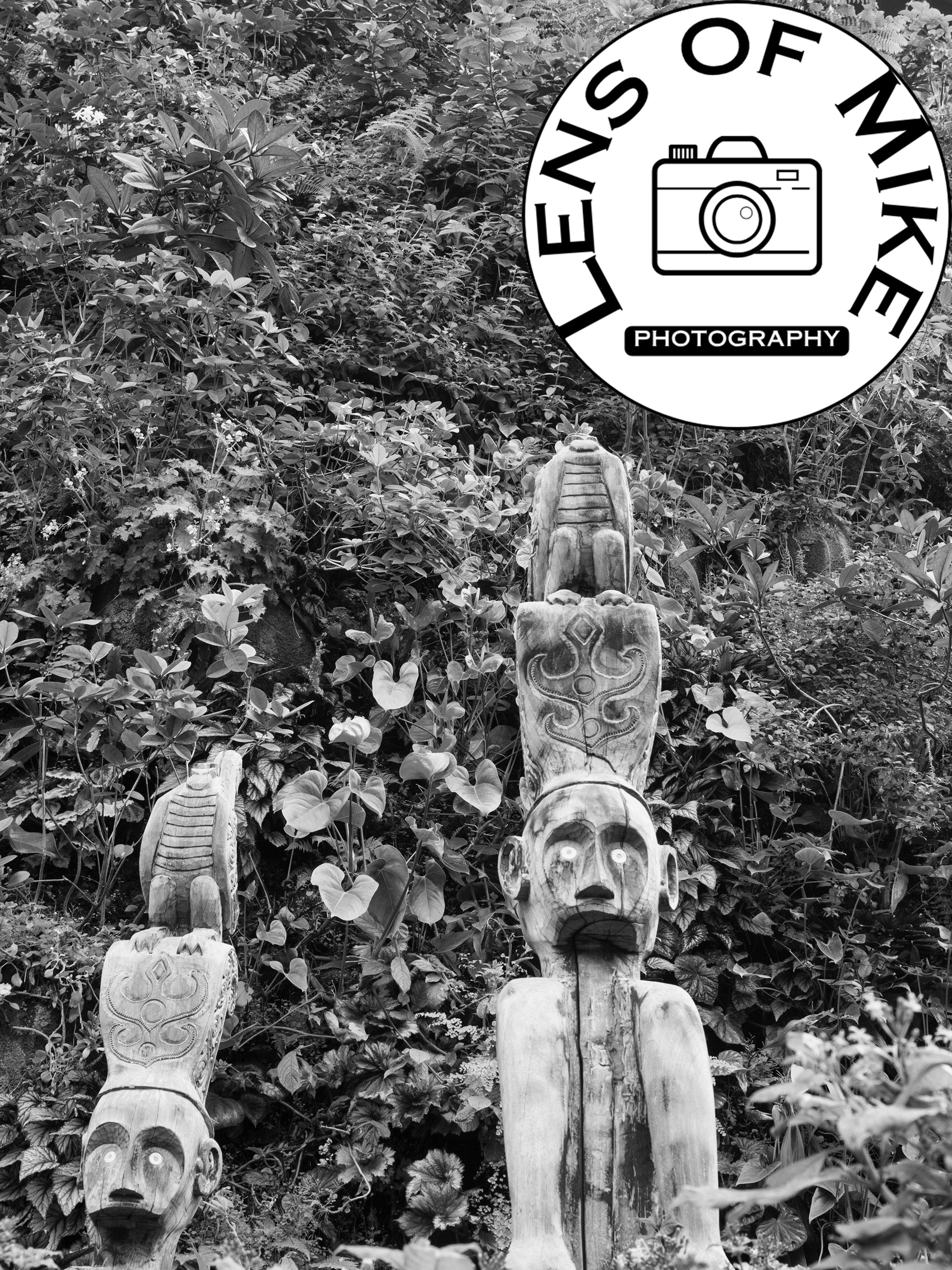 Carved Wooden Totem Poles in Lush Foliage Black and White Print